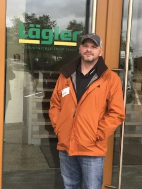 Jim Kramer refinishing a hardwood floor
