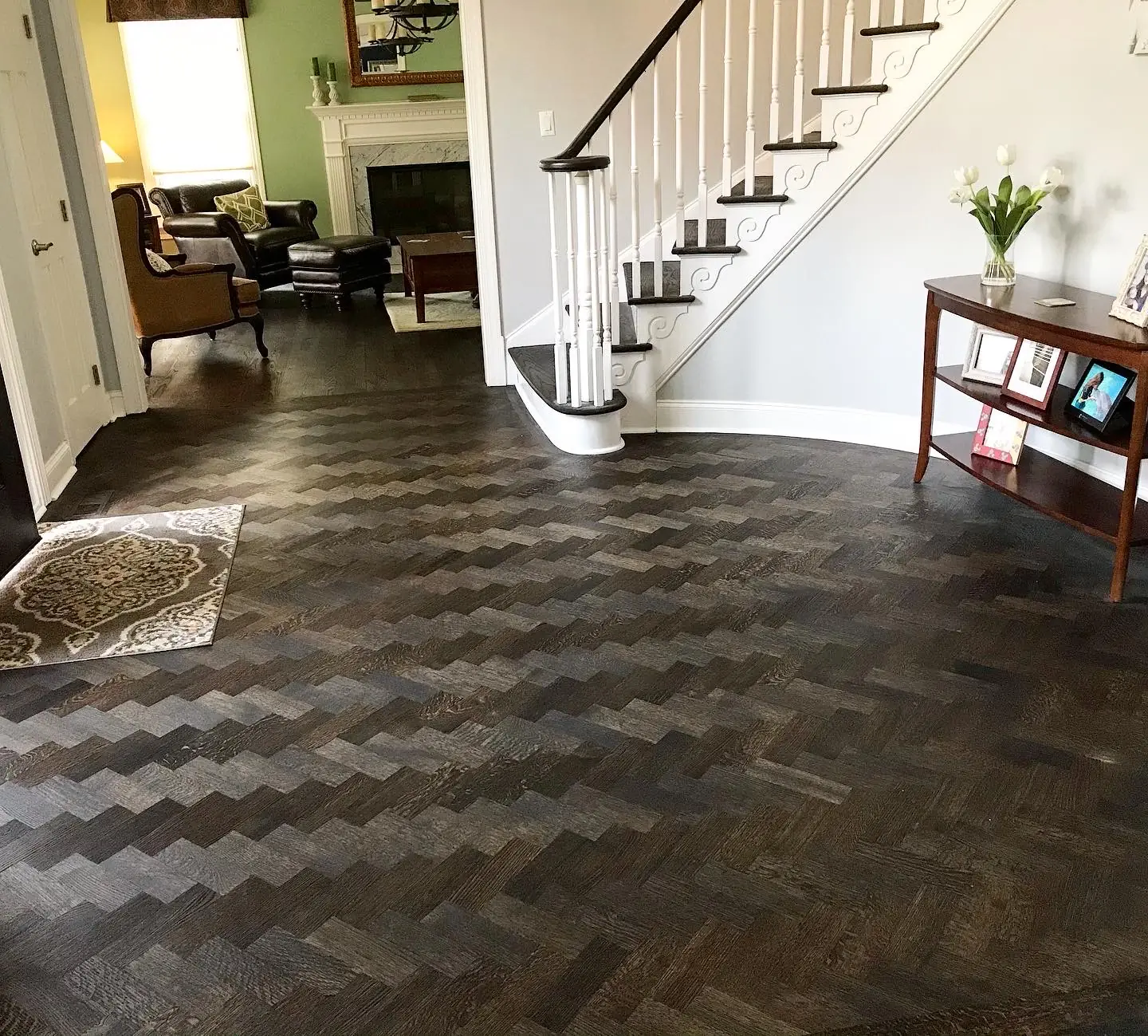 Wide staircase with matching hardwood treads and landing